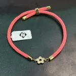 عکس دستبند سبک چرم و طلا با طرح گل