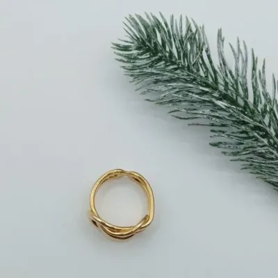 قیمت خرید انگشتر طلای 18 عیار زنانه مفتولی طرح گره