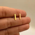 قیمت گوشواره میخی لیزری طلا خط زنانه و دخترانه 18 عیار