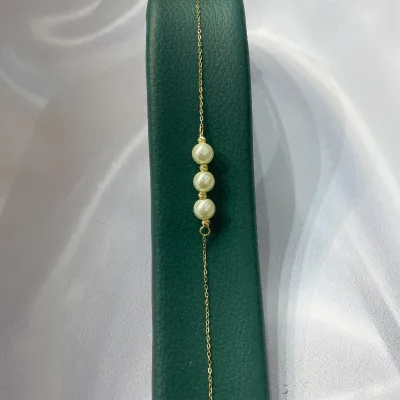 عکس دستبند طلا مونیک مروارید و گوی زنانه و دخترانه 18 عیار