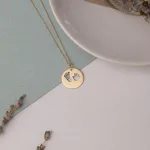 قیمت پلاک طلا لیزری طرح ردپا و دست نوزاد دختر و پسر وزن کم