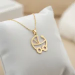 قیمت پلاک لیزری طلا نوزاد طرح کالسکه دختر و پسر کم وزن و شیک