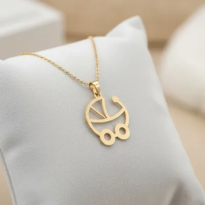 قیمت پلاک لیزری طلا نوزاد طرح کالسکه دختر و پسر کم وزن و شیک